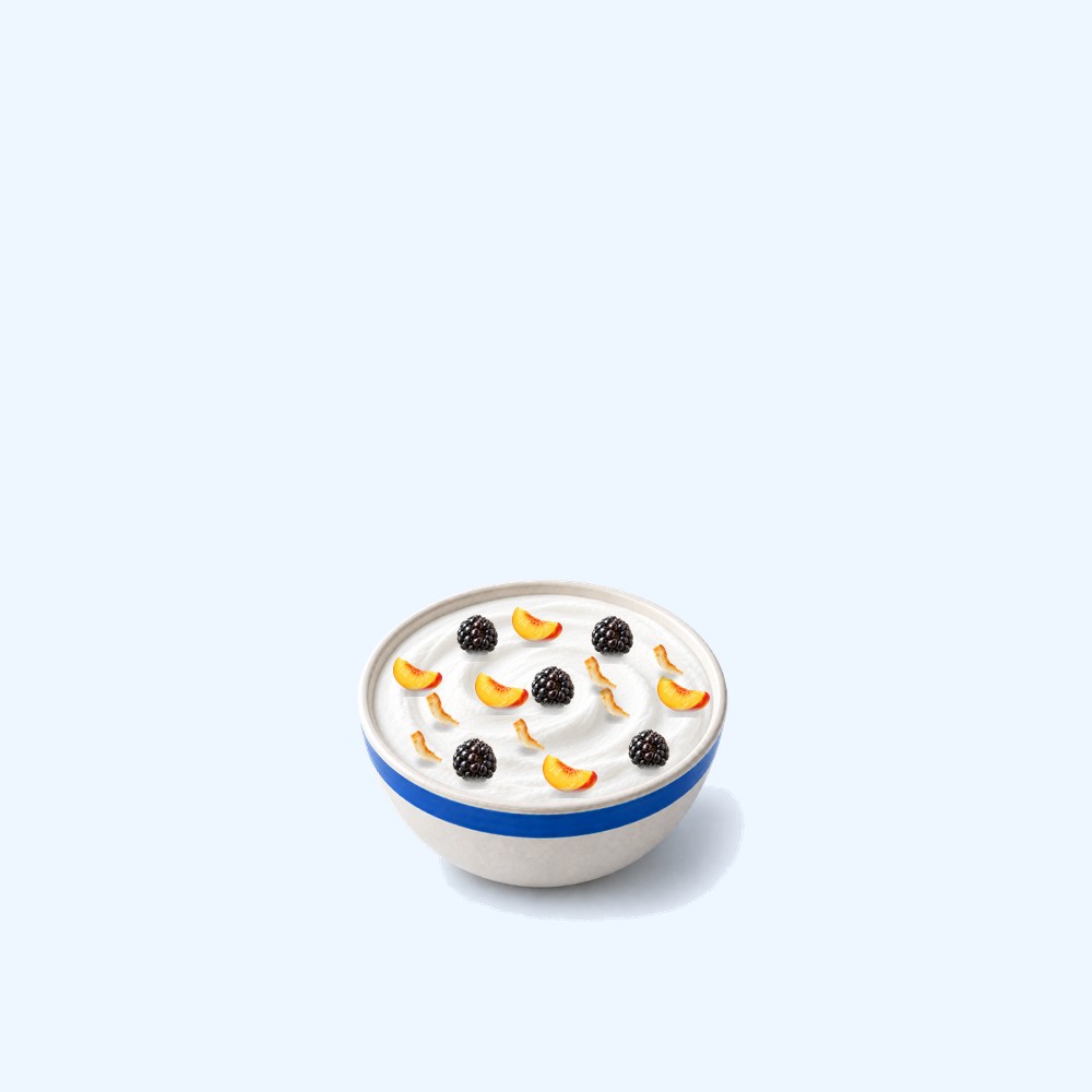 The mini bowl, about half the size, with peach, blackberries and coconut flakes.